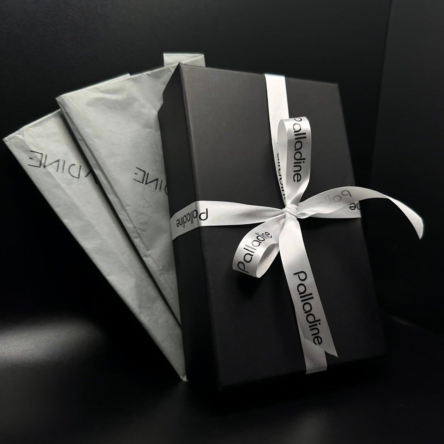 Elegant deluxe gift wrapping with a personalized card, delicate wrapping tissue, luxury gift box, and stylish ribbon for a beautifully presented gift