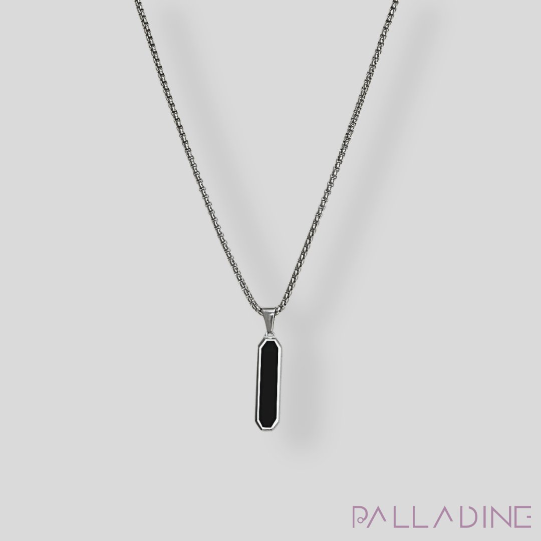 Discover elegance with our Rhodium-plated pendant featuring a striking black stainless steel center. A perfect accessory to add a touch of luxury to any outfit.