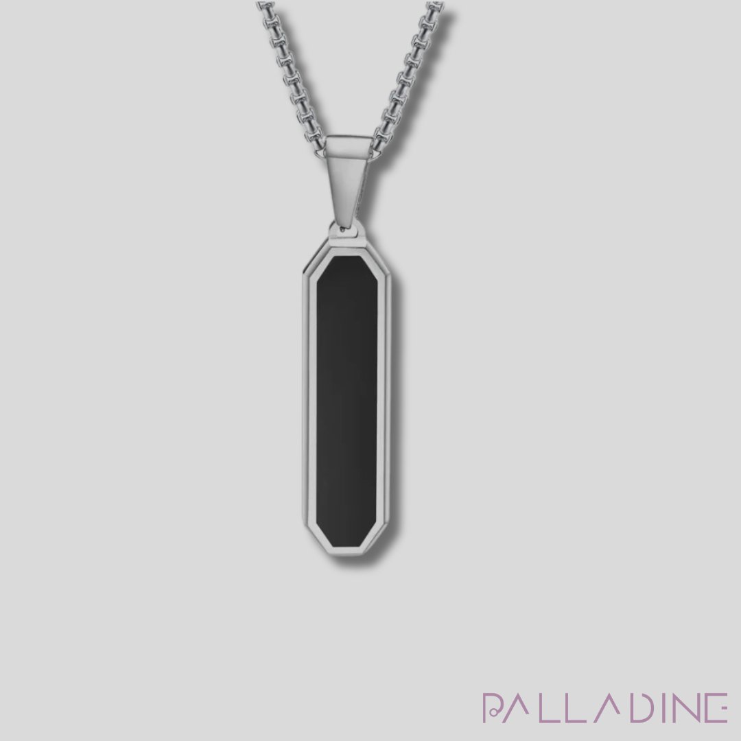 Discover elegance with our Rhodium-plated pendant featuring a striking black stainless steel center. A perfect accessory to add a touch of luxury to any outfit.