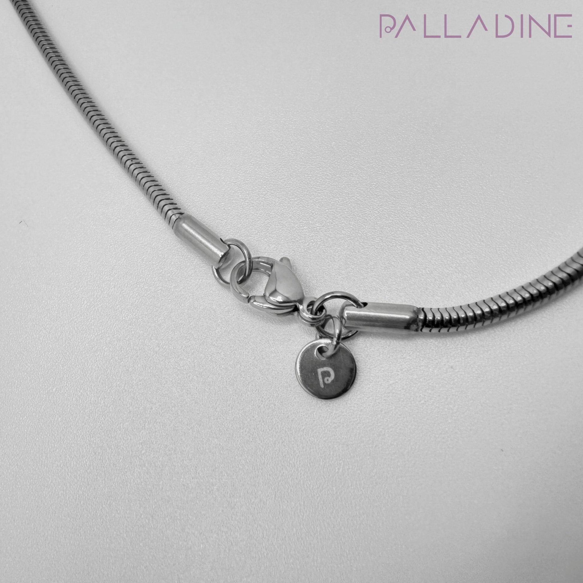 Stainless steel snake chain necklace, 2.4mm round chain plated in rhodium for a luxurious shine.